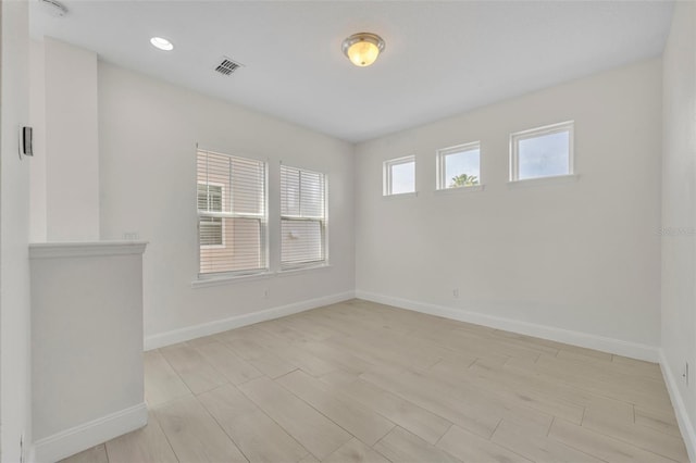 13913 Hahn Ln, Orlando, FL 32827 - empty room with baseboards, light wood-style floors, and recessed lighting