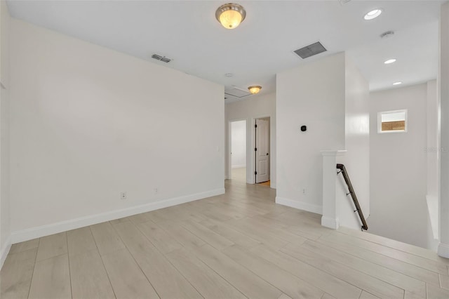 13913 Hahn Ln, Orlando, FL 32827 - spare room featuring light wood-type flooring, baseboards, recessed lighting, and a smoke detector