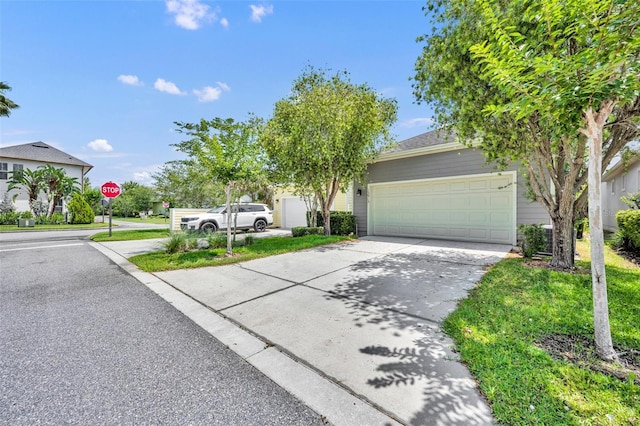13913 Hahn Ln, Orlando, FL 32827 - view of front of house with an attached garage and driveway