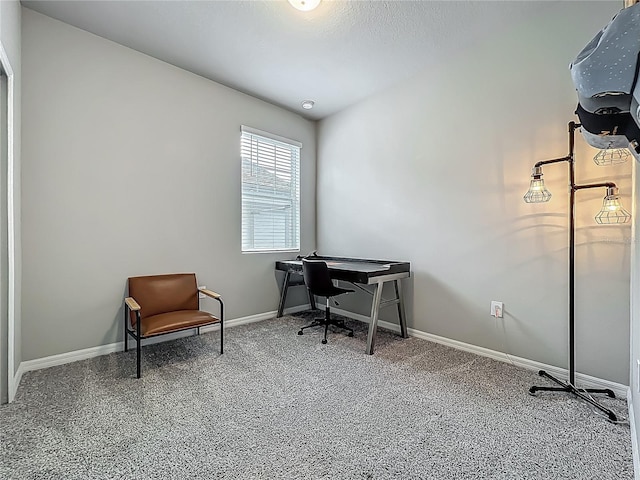 home office with baseboards and carpet flooring