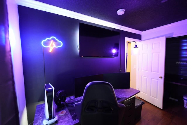 home theater featuring a textured ceiling and dark wood finished floors