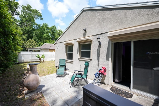 view of patio featuring fence