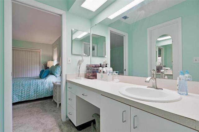 bathroom featuring connected bathroom and vanity