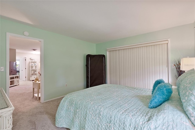 bedroom featuring carpet floors and baseboards