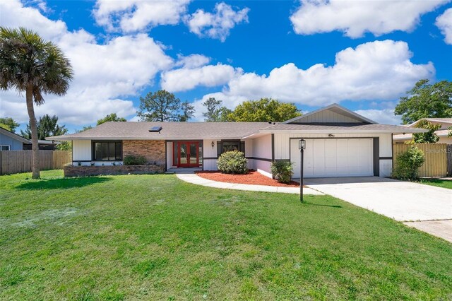 713 Coach Light Dr, Fern Park, FL 32730 - single story home featuring a garage, french doors, and concrete driveway