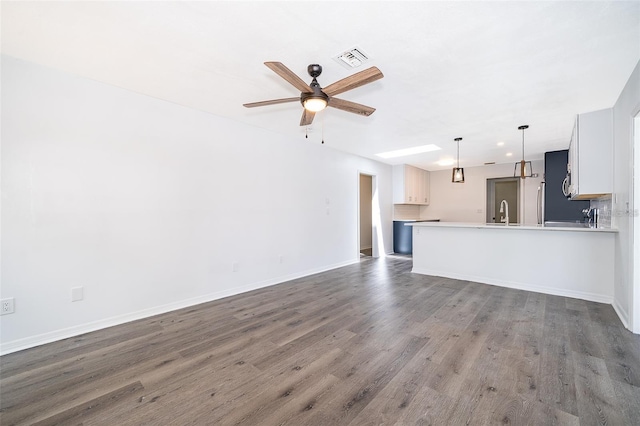 713 Coach Light Dr, Fern Park, FL 32730 - unfurnished living room with a ceiling fan, wood finished floors, and baseboards