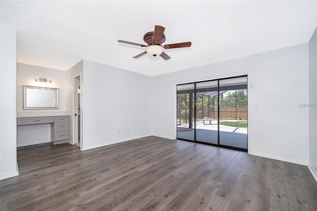 713 Coach Light Dr, Fern Park, FL 32730 - unfurnished bedroom featuring access to exterior, dark wood-style floors, baseboards, and a ceiling fan