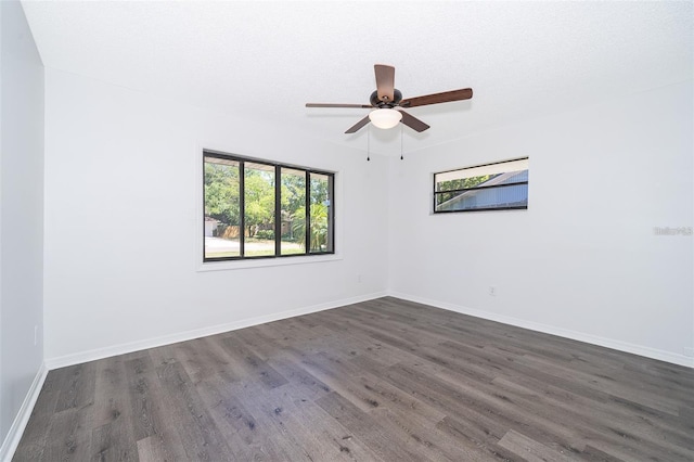 713 Coach Light Dr, Fern Park, FL 32730 - empty room featuring healthy amount of natural light, dark wood-style flooring, baseboards, and a ceiling fan