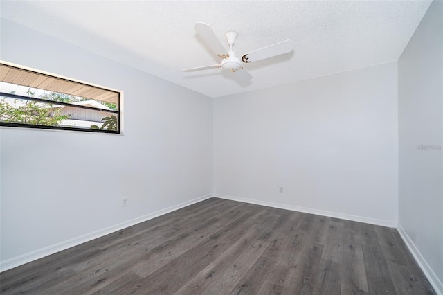 713 Coach Light Dr, Fern Park, FL 32730 - unfurnished room with dark wood-style floors, baseboards, and a ceiling fan