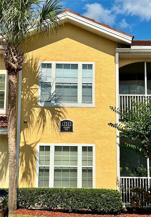 12212 Wild Iris Way Unit 106, Orlando, FL 32837 - view of side of home featuring stucco siding