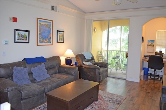 12212 Wild Iris Way Unit 106, Orlando, FL 32837 - living room featuring arched walkways, wood finished floors, an office area, vaulted ceiling, and a ceiling fan