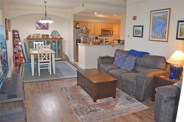 12212 Wild Iris Way Unit 106, Orlando, FL 32837 - living area featuring wood finished floors, crown molding, and a chandelier