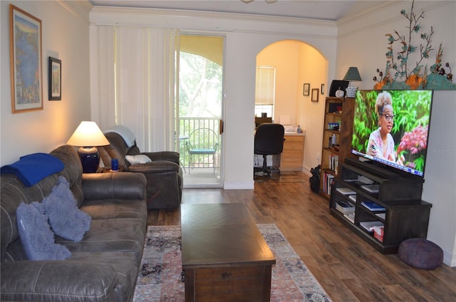 12212 Wild Iris Way Unit 106, Orlando, FL 32837 - living area with arched walkways, ornamental molding, wood finished floors, plenty of natural light, and baseboards