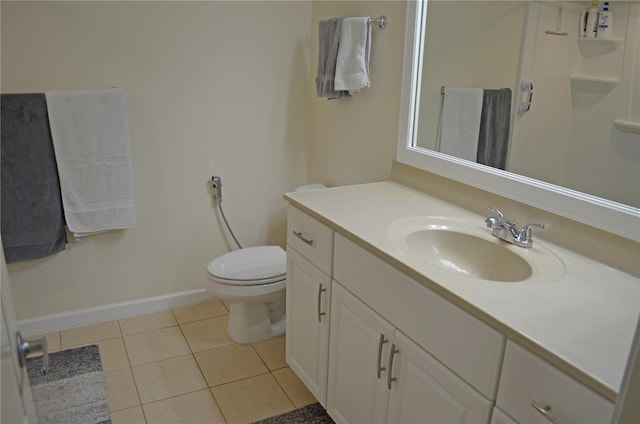 12212 Wild Iris Way Unit 106, Orlando, FL 32837 - bathroom featuring tile patterned floors, baseboards, vanity, and toilet