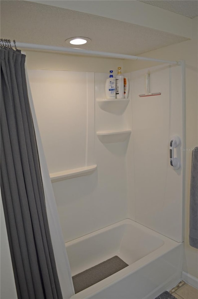 12212 Wild Iris Way Unit 106, Orlando, FL 32837 - full bath featuring recessed lighting, baseboards, and shower / tub combo