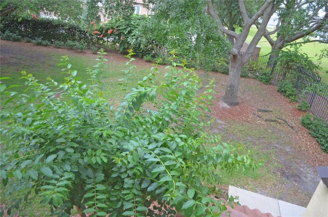 12212 Wild Iris Way Unit 106, Orlando, FL 32837 - view of yard featuring fence
