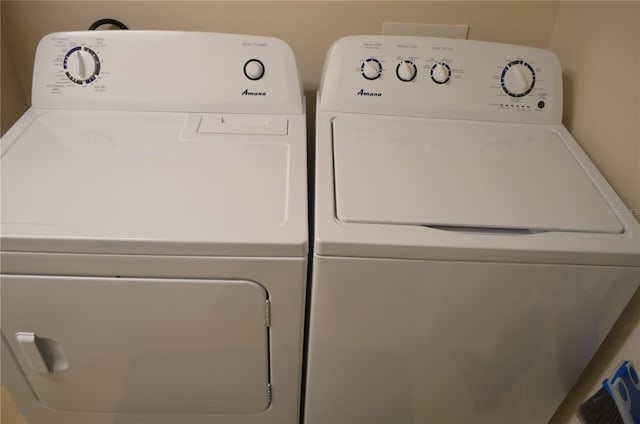 12212 Wild Iris Way Unit 106, Orlando, FL 32837 - clothes washing area with washing machine and dryer
