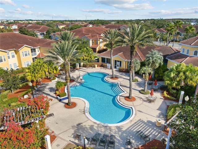 12212 Wild Iris Way Unit 106, Orlando, FL 32837 - community pool featuring a residential view and a patio