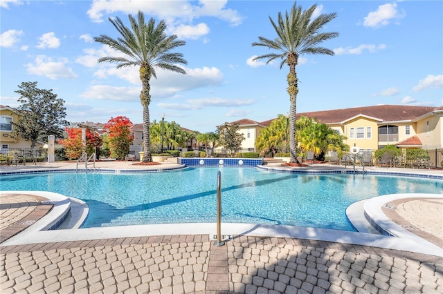 12212 Wild Iris Way Unit 106, Orlando, FL 32837 - community pool featuring fence