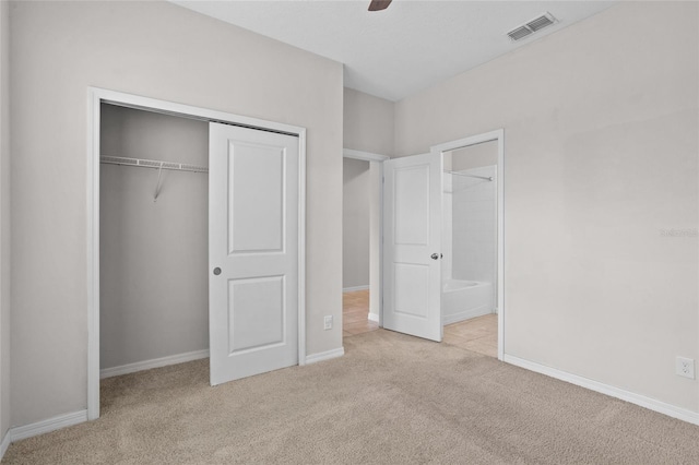 15651 Kinnow Mandarin Ln, Winter Garden, FL 34787 - unfurnished bedroom with carpet flooring, a closet, baseboards, and a ceiling fan