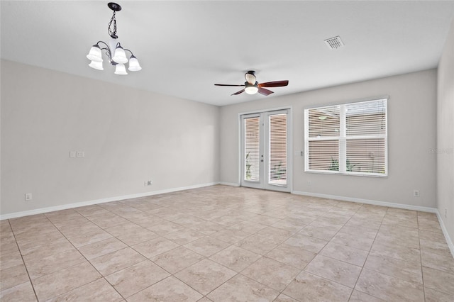 15651 Kinnow Mandarin Ln, Winter Garden, FL 34787 - empty room with light tile patterned flooring, ceiling fan, baseboards, and a chandelier