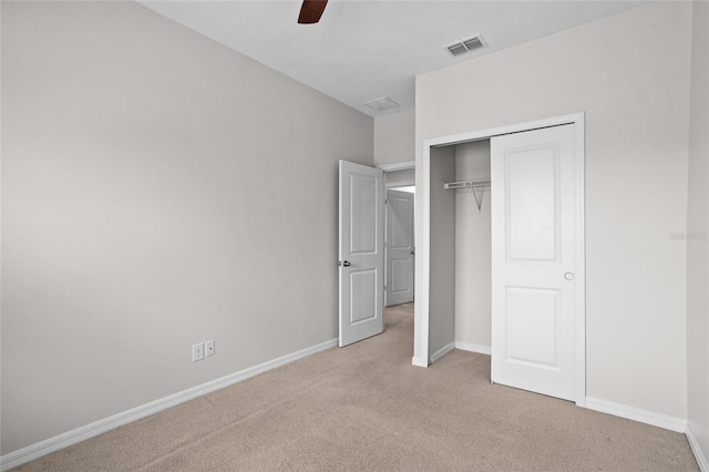 15651 Kinnow Mandarin Ln, Winter Garden, FL 34787 - unfurnished bedroom featuring light carpet, baseboards, a closet, and ceiling fan