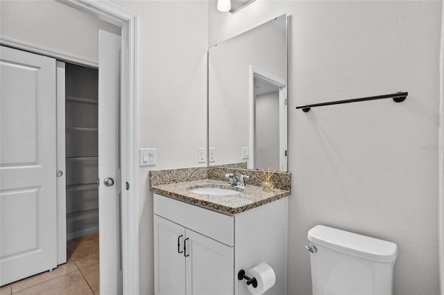 15651 Kinnow Mandarin Ln, Winter Garden, FL 34787 - half bath featuring tile patterned floors, toilet, and vanity