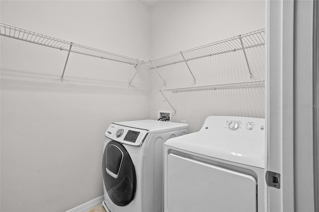 15651 Kinnow Mandarin Ln, Winter Garden, FL 34787 - laundry room featuring washing machine and dryer and baseboards