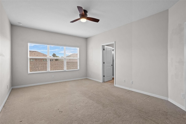 15651 Kinnow Mandarin Ln, Winter Garden, FL 34787 - empty room with light carpet, a ceiling fan, and baseboards