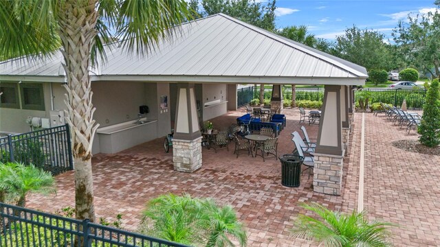 15651 Kinnow Mandarin Ln, Winter Garden, FL 34787 - view of patio / terrace with fence and outdoor dining space