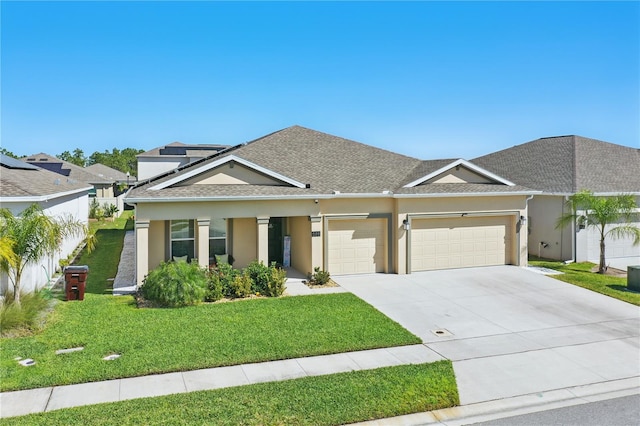 view of front of house featuring a garage, a front lawn, stucco siding, concrete driveway, and roof with shingles