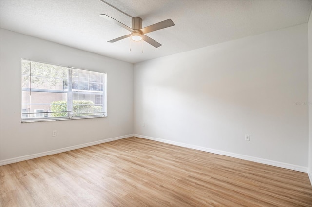 1163 Paseo Del Mar Unit B, Casselberry, FL 32707 - spare room featuring light wood-style flooring, ceiling fan, baseboards, and a textured ceiling