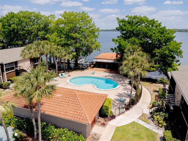 1163 Paseo Del Mar Unit B, Casselberry, FL 32707 - community pool with a water view, fence, and a patio area