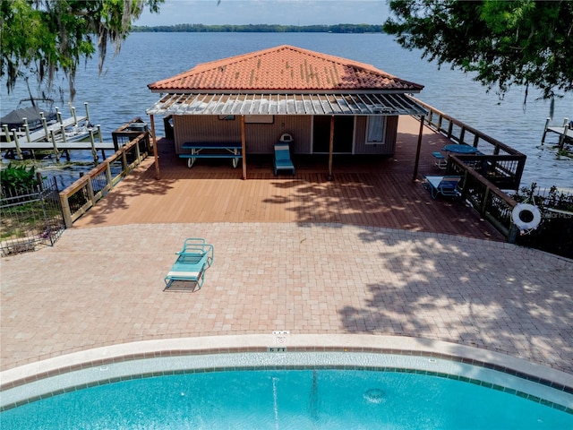 1163 Paseo Del Mar Unit B, Casselberry, FL 32707 - rear view of property with a deck with water view, a tiled roof, and an outdoor pool