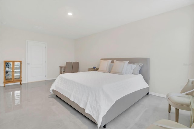 bedroom featuring baseboards and recessed lighting