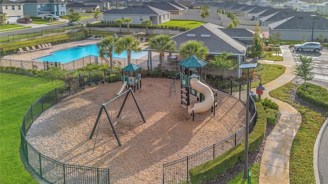 community jungle gym with a residential view