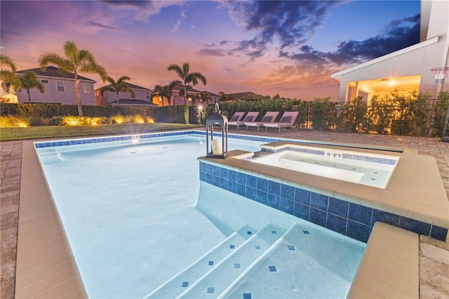 257 Auburn Ave, Kissimmee, FL 34747 - view of swimming pool with an in-ground hot tub and fence