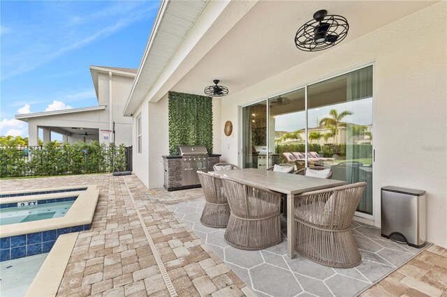 257 Auburn Ave, Kissimmee, FL 34747 - view of patio / terrace featuring an in-ground hot tub, outdoor dining area, and a grill