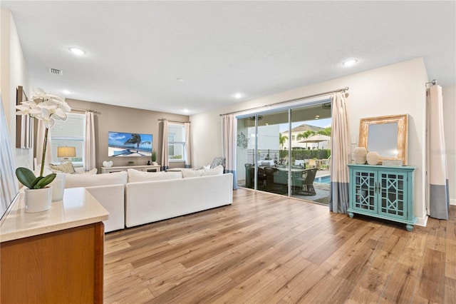 257 Auburn Ave, Kissimmee, FL 34747 - living room featuring light wood-style flooring and recessed lighting
