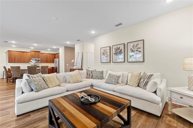 257 Auburn Ave, Kissimmee, FL 34747 - living area with light wood finished floors and recessed lighting