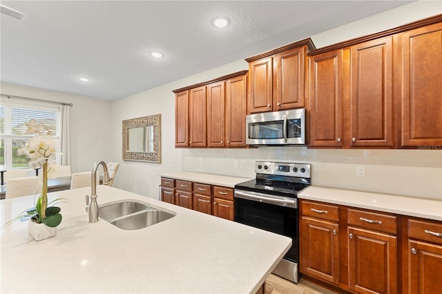 257 Auburn Ave, Kissimmee, FL 34747 - kitchen with appliances with stainless steel finishes, a sink, light countertops, recessed lighting, and backsplash