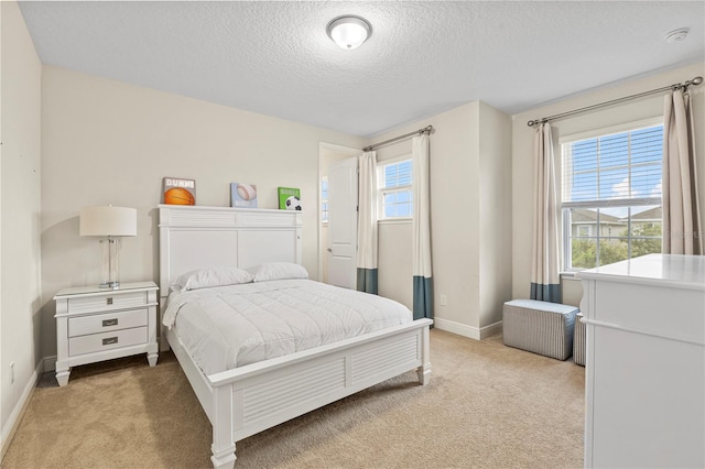 257 Auburn Ave, Kissimmee, FL 34747 - carpeted bedroom with a textured ceiling and baseboards