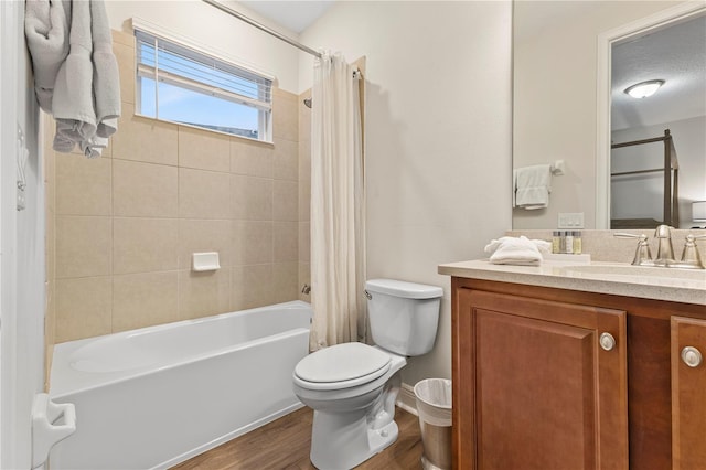 257 Auburn Ave, Kissimmee, FL 34747 - bathroom featuring wood finished floors, toilet, vanity, and shower / bath combo with shower curtain