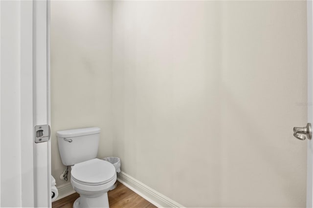 257 Auburn Ave, Kissimmee, FL 34747 - bathroom with baseboards, wood finished floors, and toilet