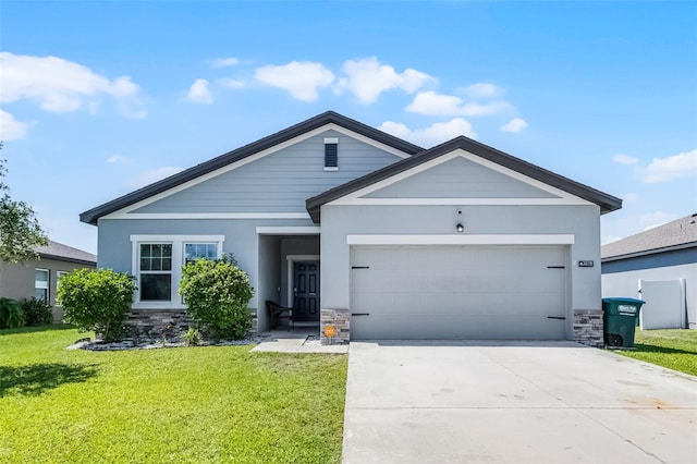 3519 Fernanda Dr, Deltona, FL 32738 - ranch-style house with stone siding, an attached garage, a front yard, and driveway