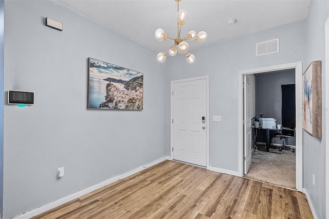 3519 Fernanda Dr, Deltona, FL 32738 - unfurnished dining area featuring an office area, wood finished floors, a chandelier, and baseboards