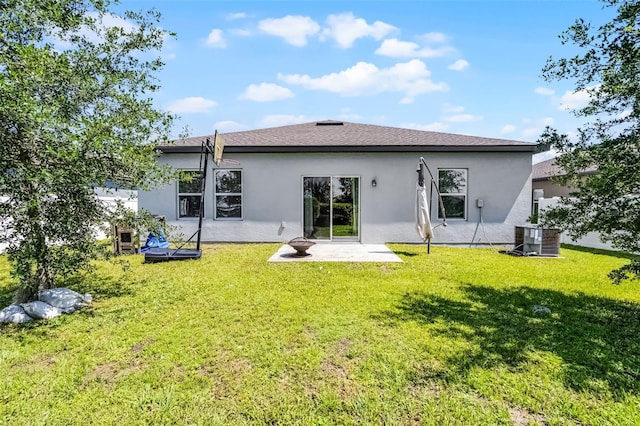 3519 Fernanda Dr, Deltona, FL 32738 - rear view of house with stucco siding, central air condition unit, and a lawn