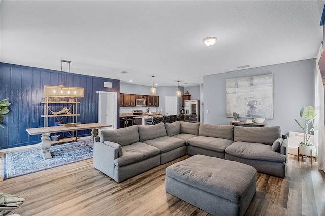 3519 Fernanda Dr, Deltona, FL 32738 - living area featuring light wood-style flooring and baseboards