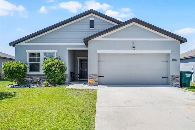 3519 Fernanda Dr, Deltona, FL 32738 - view of front of property with stone siding, an attached garage, a front lawn, concrete driveway, and stucco siding