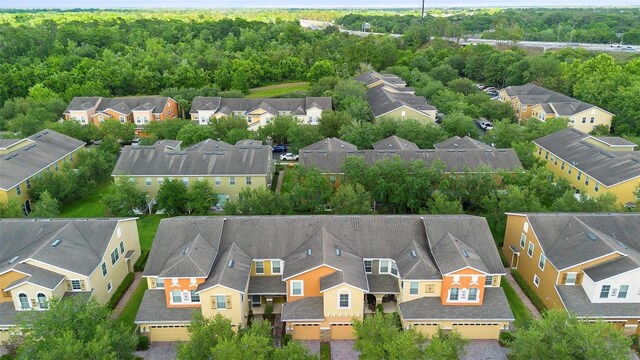 aerial view of residential area with a heavily wooded area